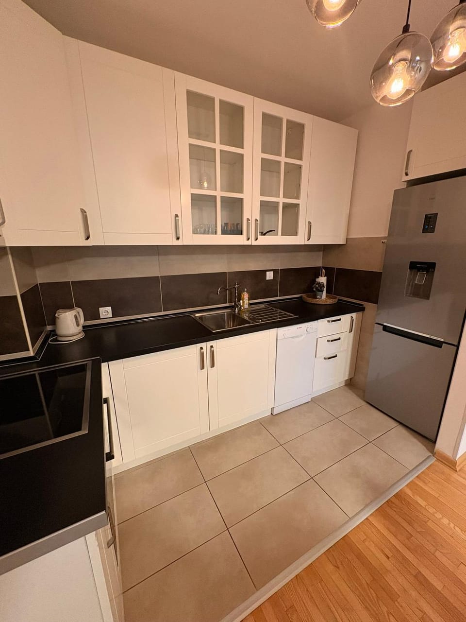 Kitchen or kitchenette, dishwasher, oven, stove