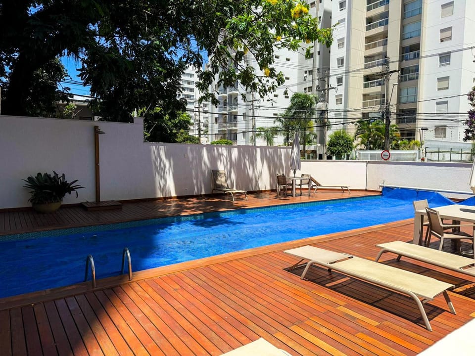 Property building, Patio, Pool view, Swimming pool, sunbed
