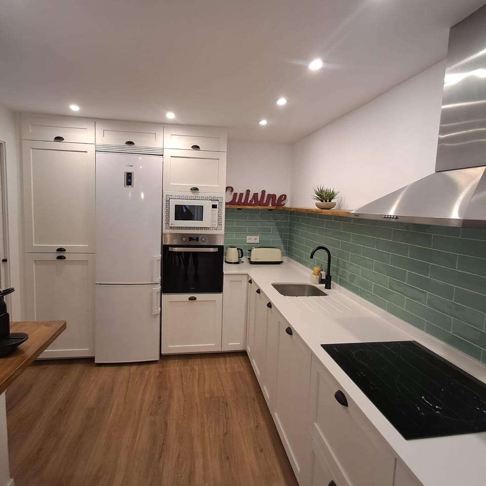 Kitchen or kitchenette, dishwasher, oven, stove, toaster