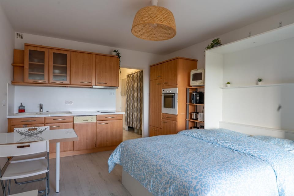 Bed, Dining area, oven, stove, wardrobe