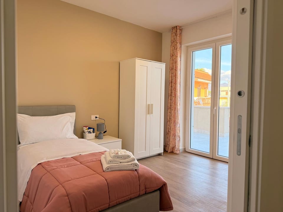 Bed, Photo of the whole room, towels, wardrobe