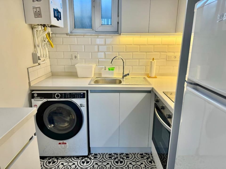 Kitchen or kitchenette, oven, stove, washing machine, dryer