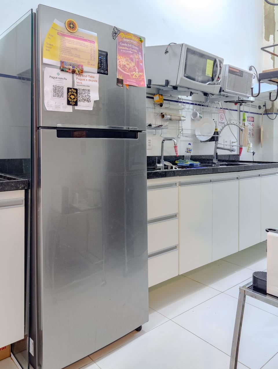 Kitchen or kitchenette, dishwasher, oven, stove
