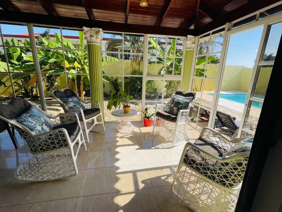 Balcony/Terrace, Living room, Seating area, Garden view, Pool view, Swimming pool, sunbed