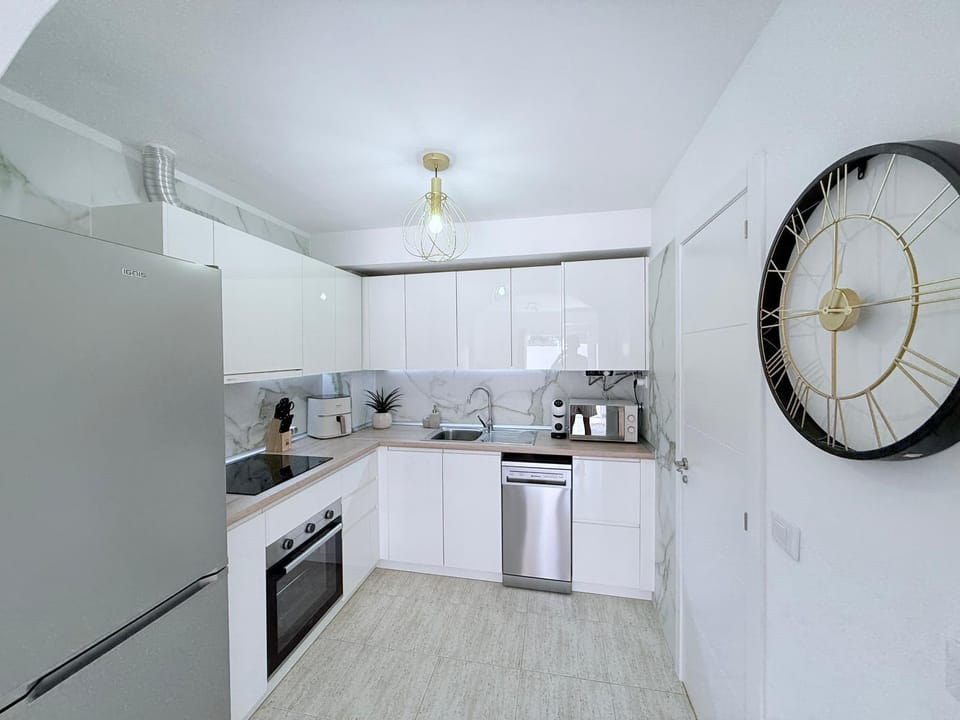 Kitchen or kitchenette, dishwasher, oven, stove