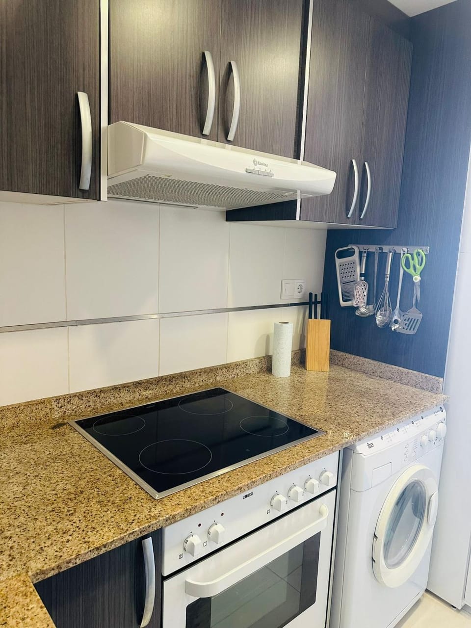 Kitchen or kitchenette, stove, washing machine