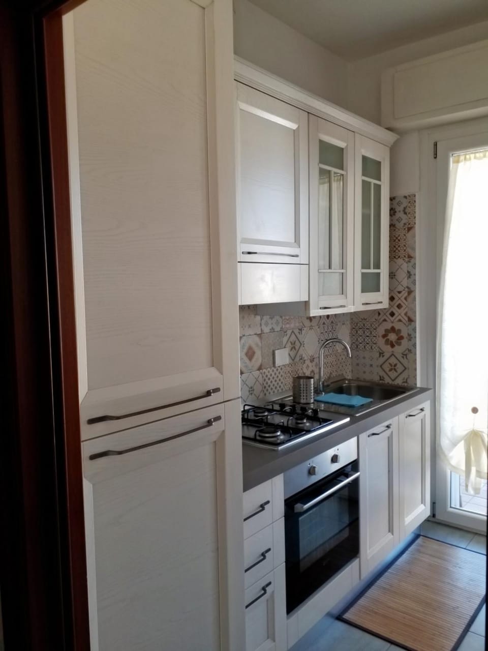 Kitchen or kitchenette, oven, stove