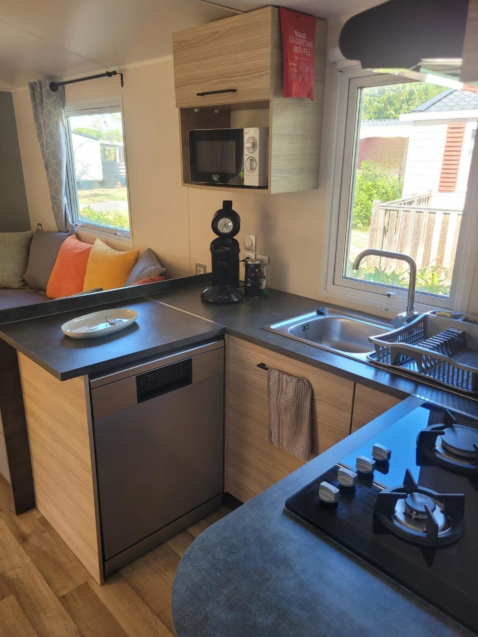 Coffee/tea facilities, dishwasher, microwave, oven, storage, stove, toaster, kitchen