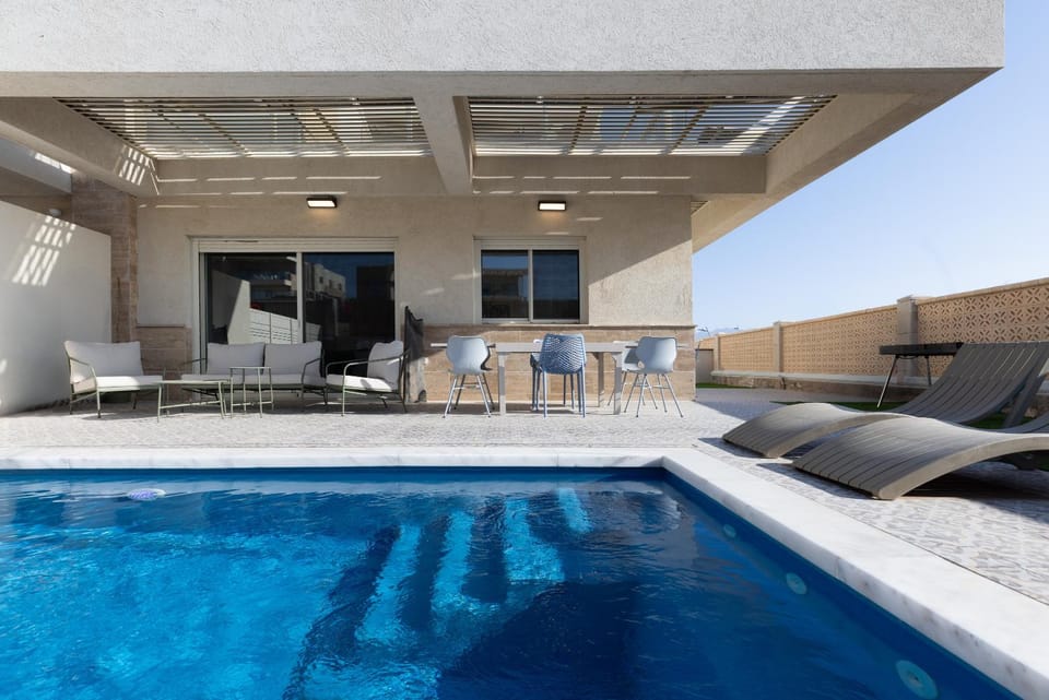 Property building, Seating area, Swimming pool