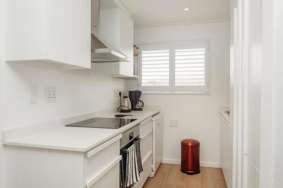 Kitchen or kitchenette, dishwasher, oven, stove, toaster