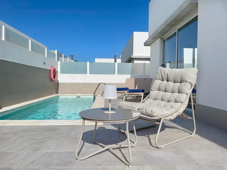 Property building, Living room, Swimming pool