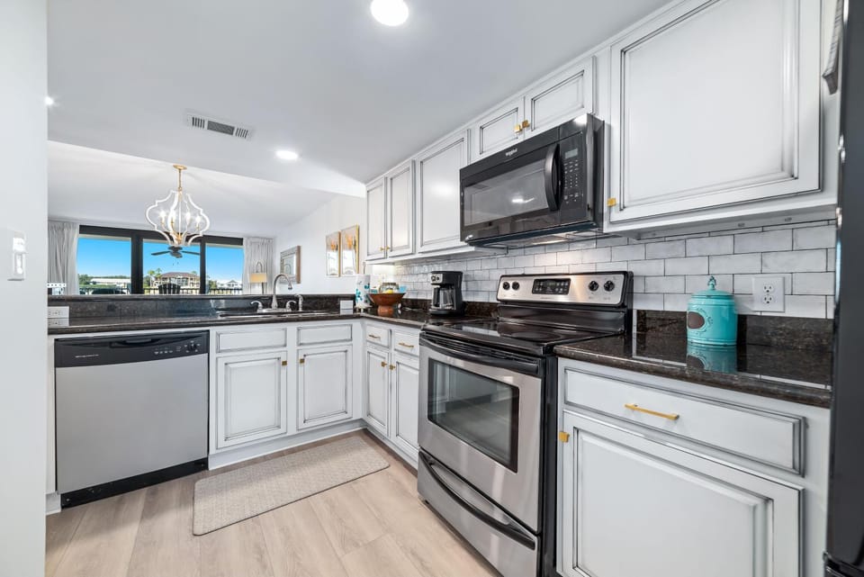 Kitchen or kitchenette, dishwasher, oven, stove, toaster