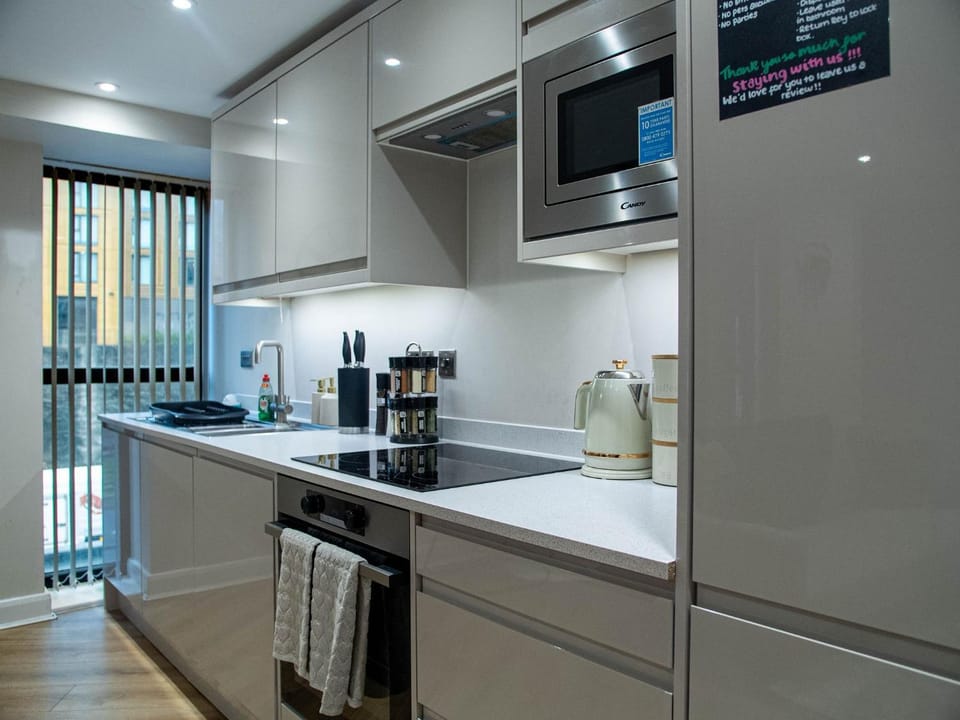 Kitchen or kitchenette, dishwasher, oven, stove, toaster
