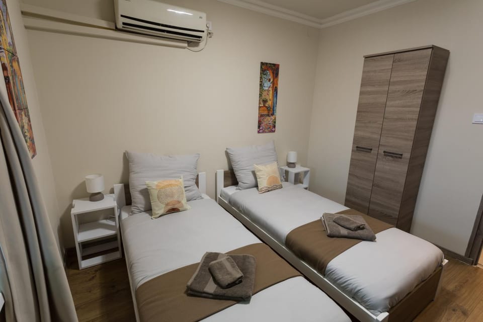 Bed, Photo of the whole room, Bedroom, towels, air conditioner