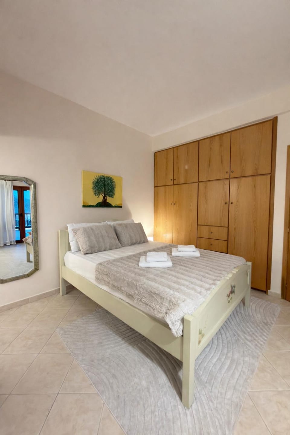 Bed, towels, wardrobe