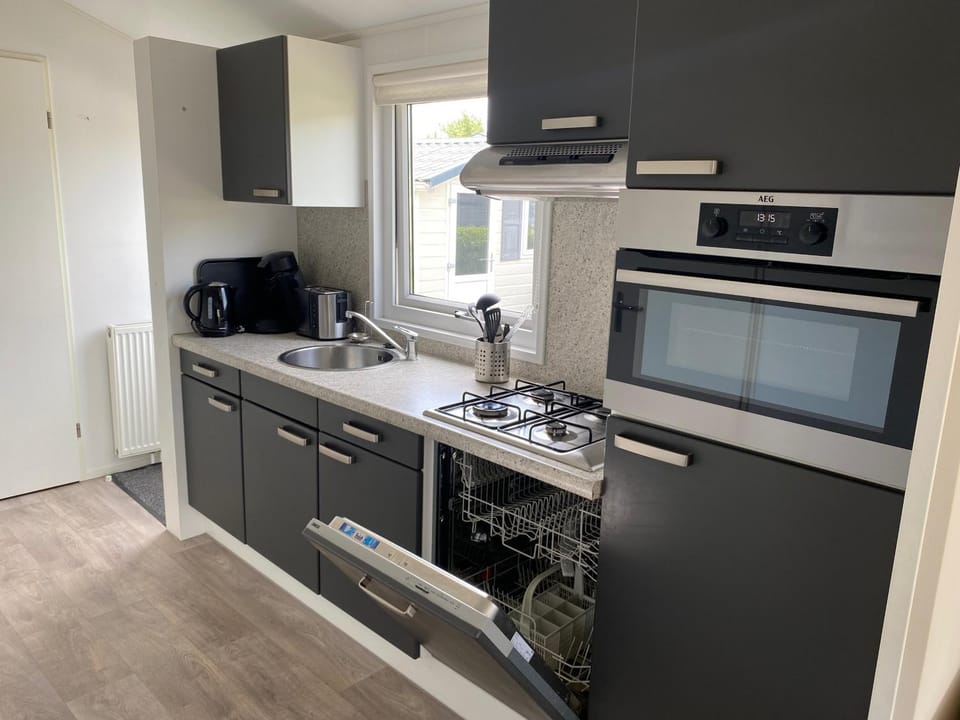 Kitchen or kitchenette, dishwasher, oven, stove, toaster