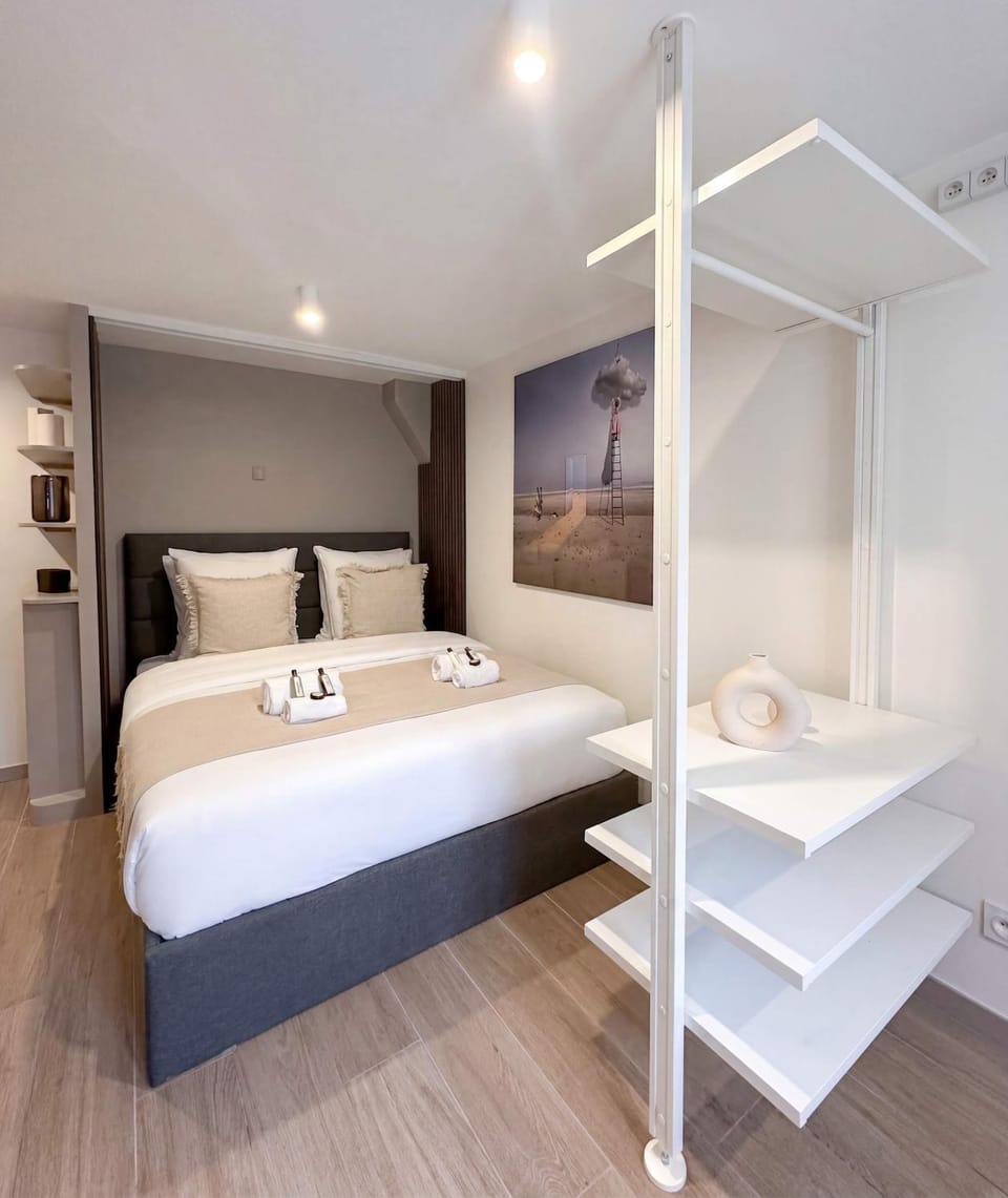 Bed, towels, wardrobe