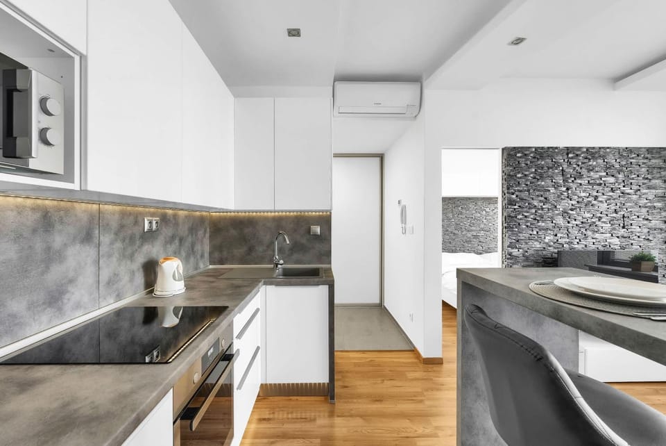 Kitchen or kitchenette, stove, air conditioner