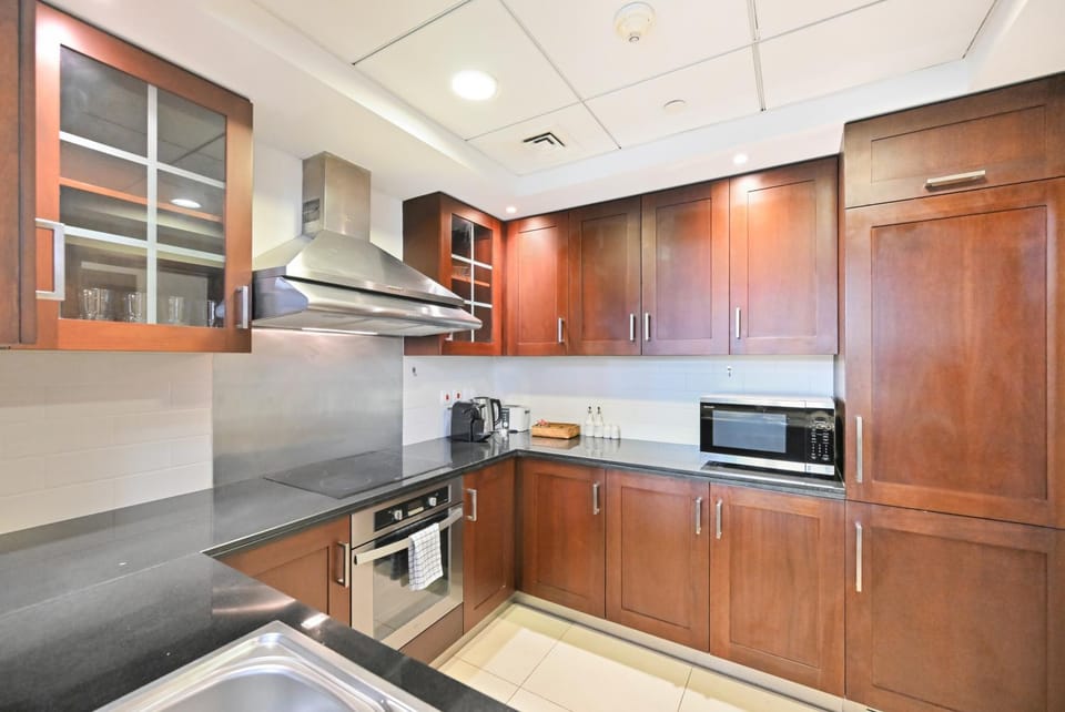 Kitchen or kitchenette, dishwasher, oven, stove, toaster