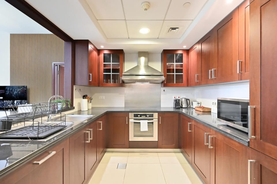 Kitchen or kitchenette, dishwasher, oven, stove, toaster