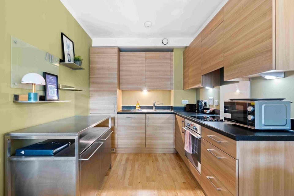 Kitchen or kitchenette, dishwasher, microwave, oven, stove, toaster