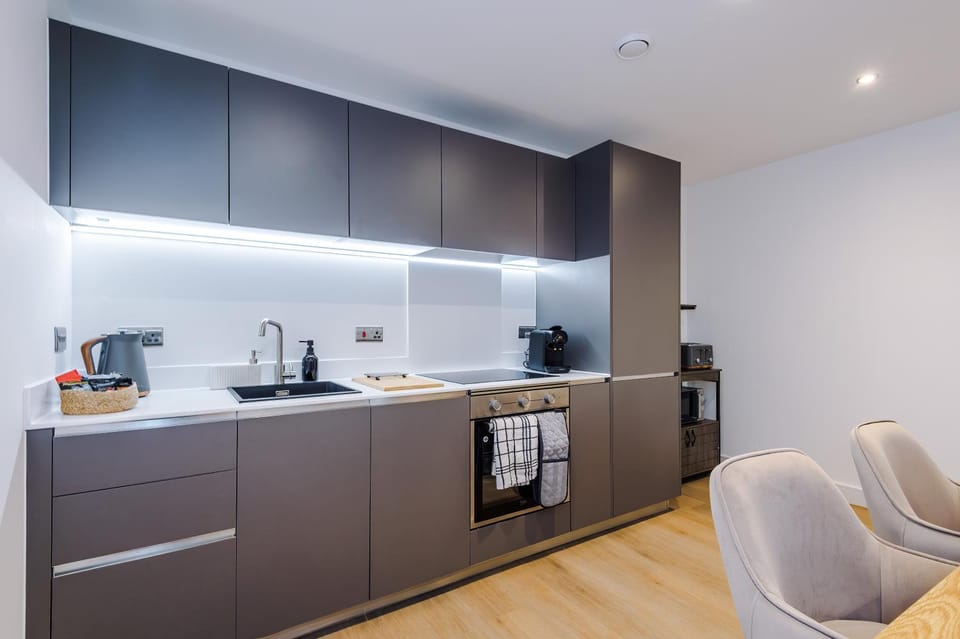Kitchen or kitchenette, dishwasher, oven, stove, toaster