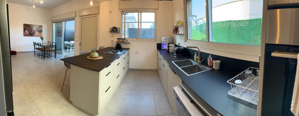 Kitchen or kitchenette, dishwasher, oven, stove