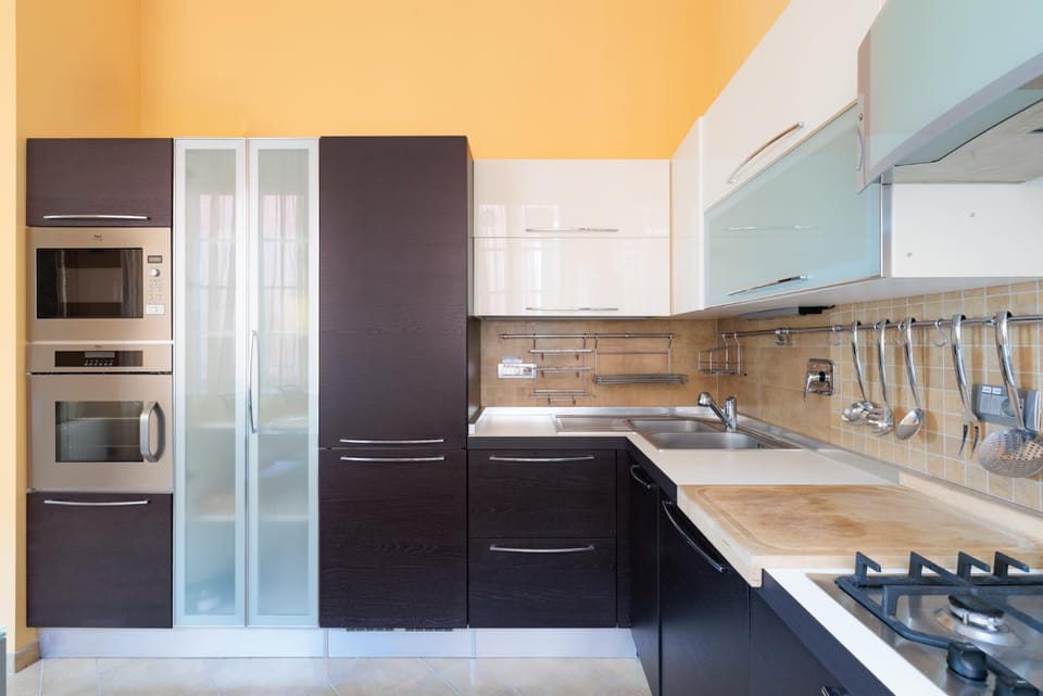 Kitchen or kitchenette, dishwasher, oven, stove