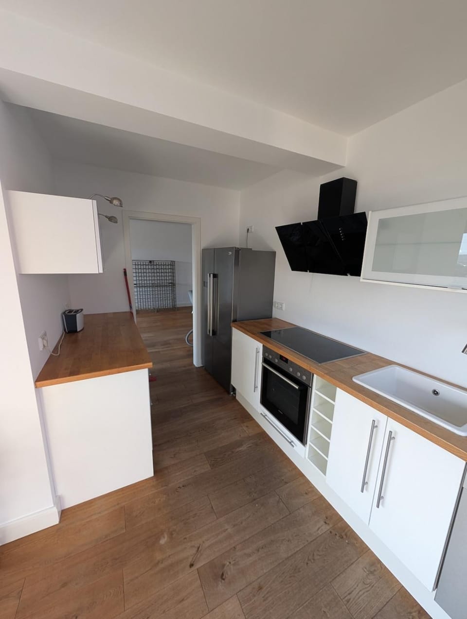 Kitchen or kitchenette, dishwasher, oven, stove