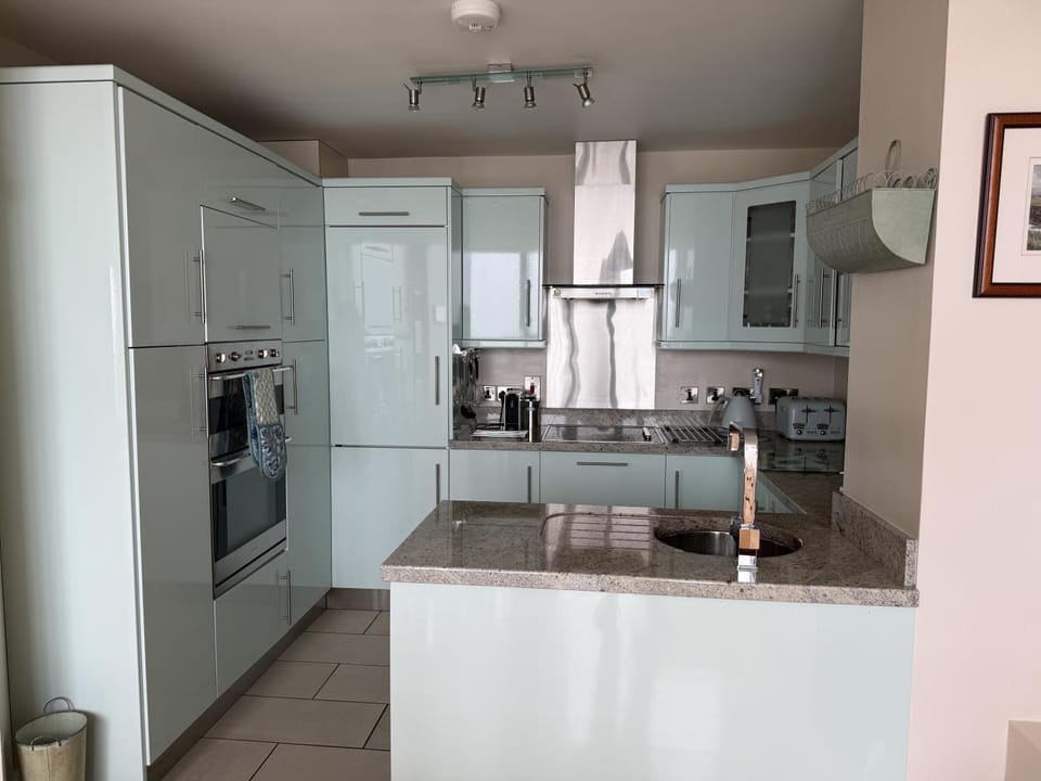Kitchen or kitchenette, dishwasher, oven, stove, washing machine, dryer