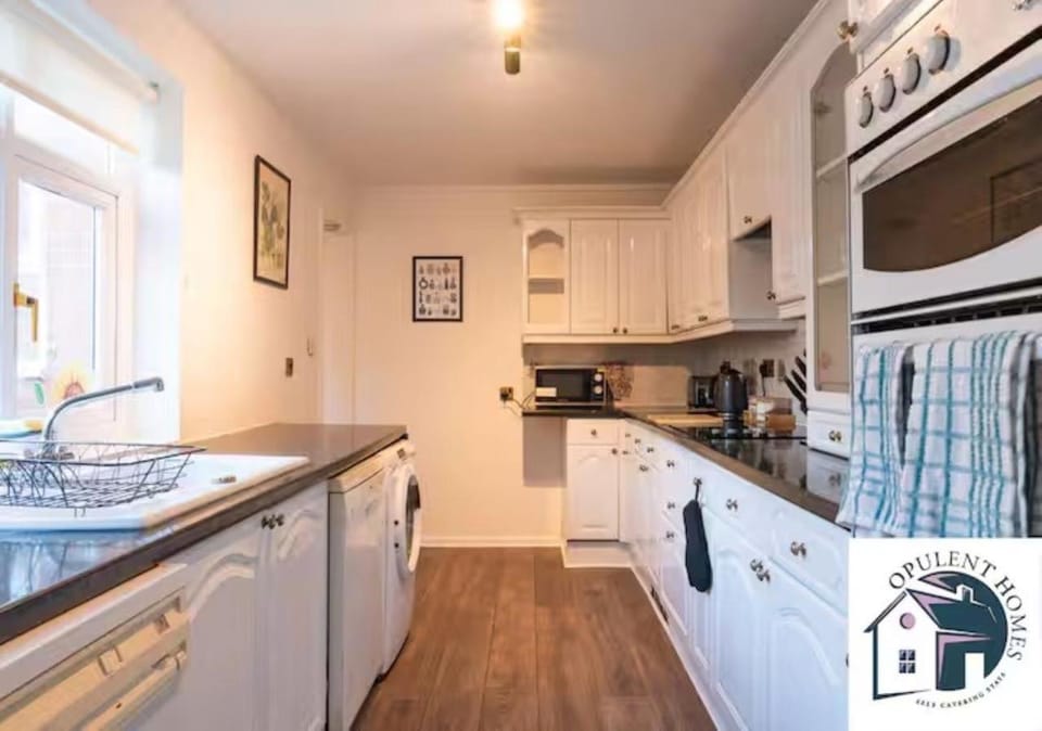 Kitchen or kitchenette, dishwasher, stove, toaster, washing machine