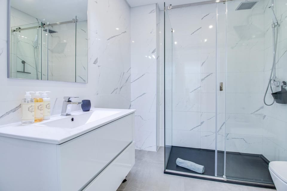 Shower, Bathroom, hair dryier, towels