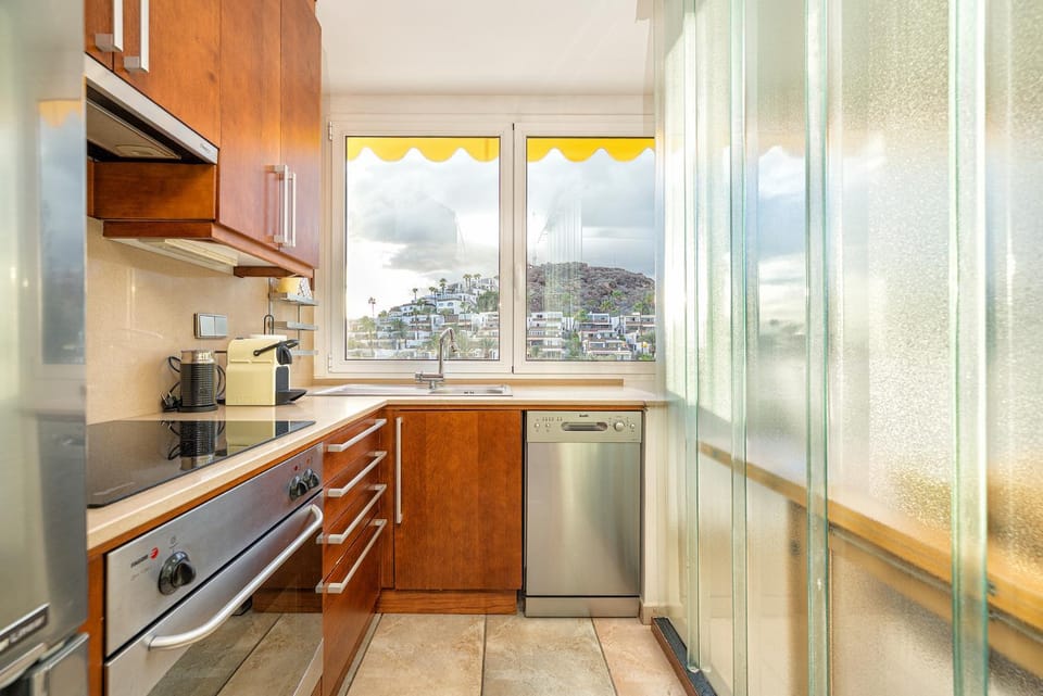 Kitchen or kitchenette, dishwasher, microwave, oven, stove, toaster