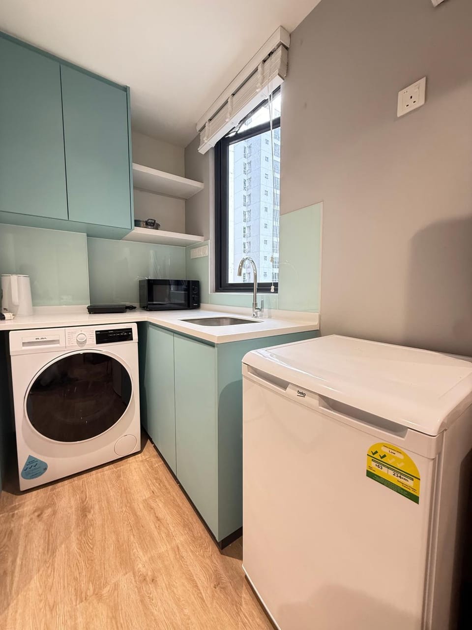 Kitchen or kitchenette, stove, washing machine