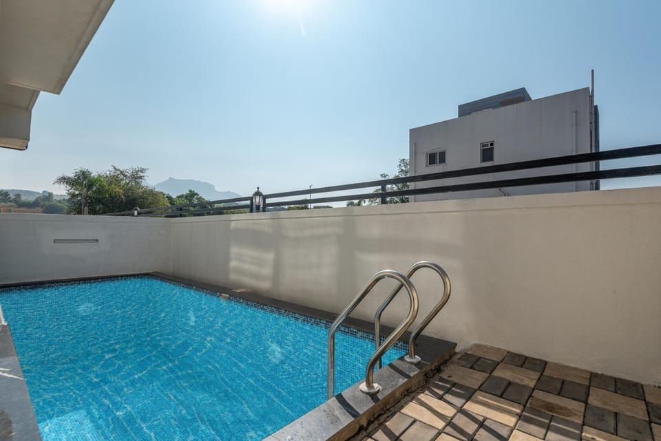 ELIVAAS Signature White House 4-BHK Villa with Panoramic Hill Views, Glass Room, Outdoor Pool & Dam nearby Villa in Maharashtra