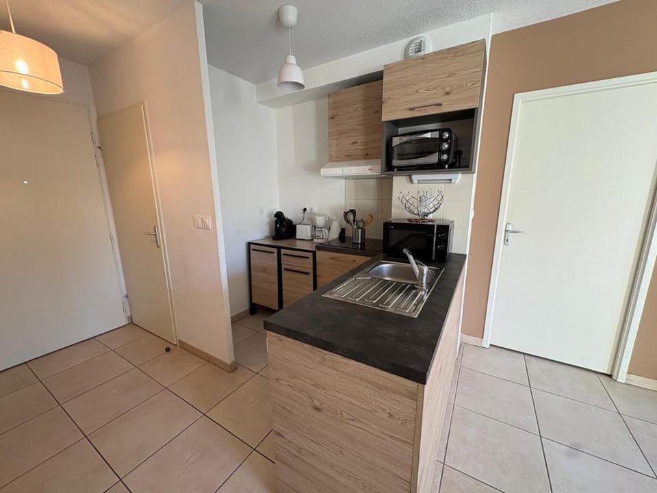 Kitchen or kitchenette, dishwasher, microwave, oven, stove, toaster