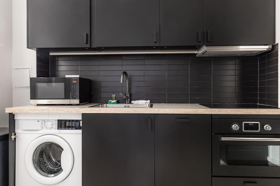 Kitchen or kitchenette, microwave, oven, stove, washing machine