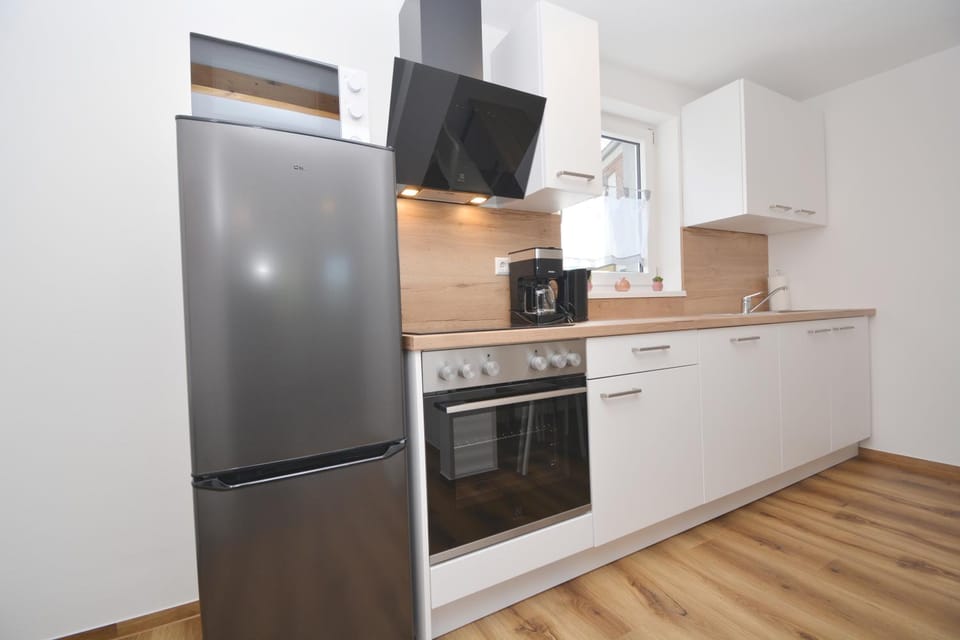 Kitchen or kitchenette, dishwasher, oven, stove