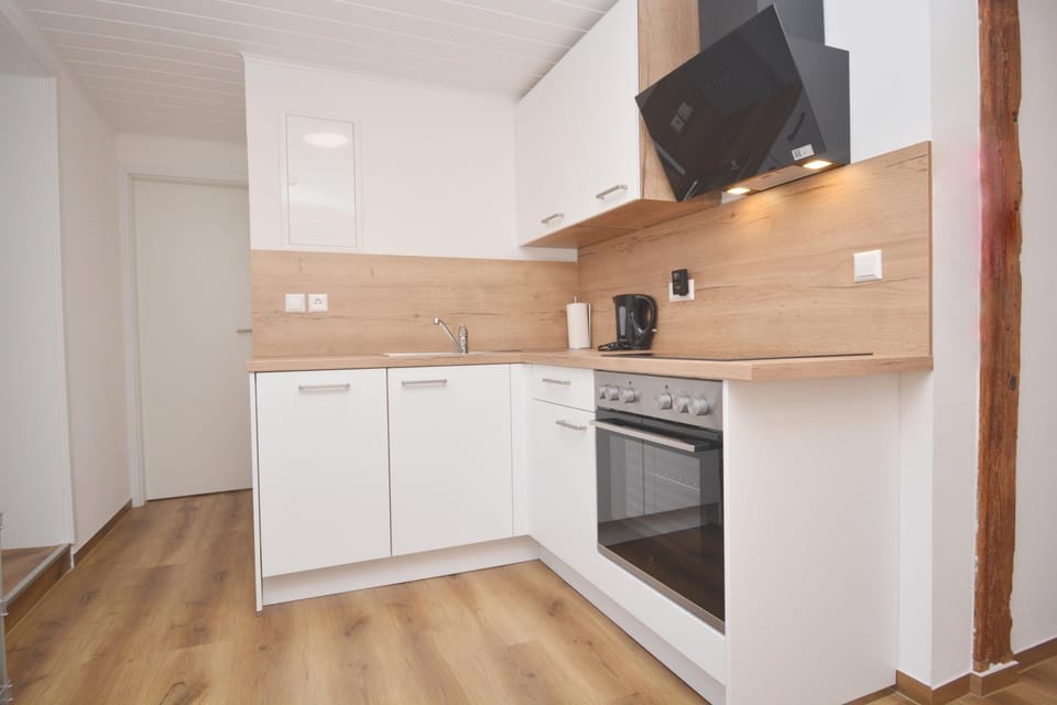 Kitchen or kitchenette, dishwasher, oven, stove