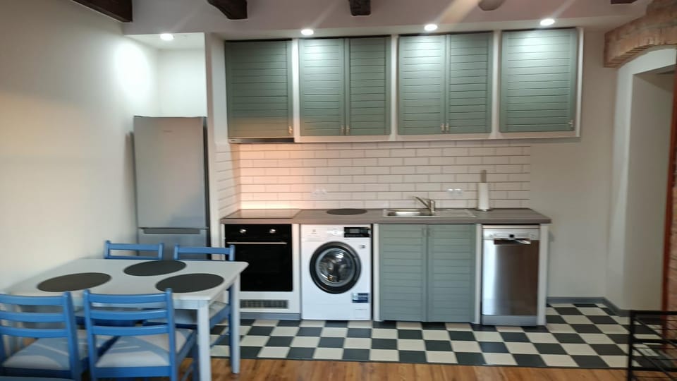 Kitchen or kitchenette, dishwasher, stove, washing machine