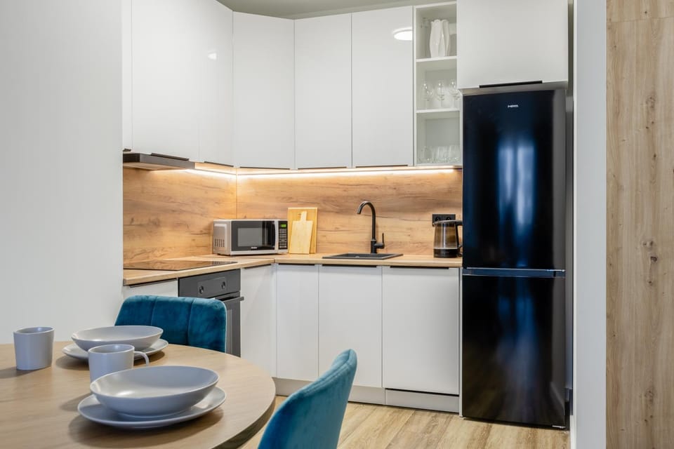 Kitchen or kitchenette, dishwasher, microwave, oven
