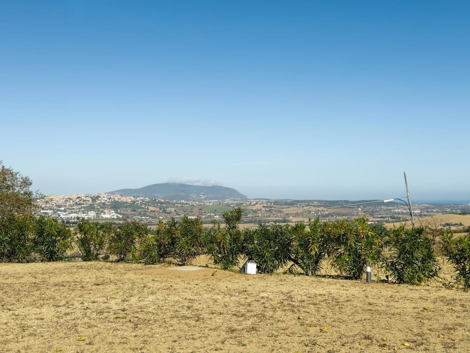 Property building, Nearby landmark, Natural landscape, Mountain view