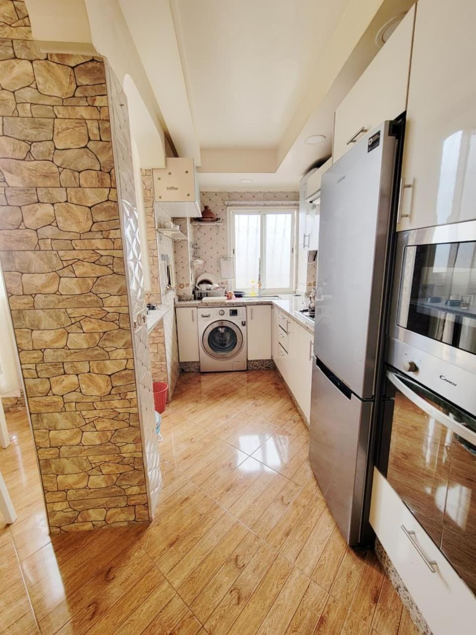 Kitchen or kitchenette, microwave, oven, washing machine