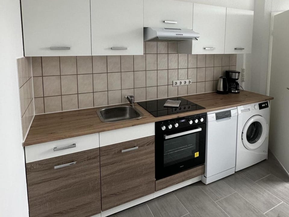 Kitchen or kitchenette, dishwasher, oven, stove, washing machine, dryer