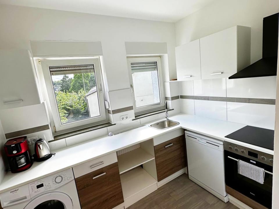Kitchen or kitchenette, dishwasher, oven, stove, washing machine, dryer