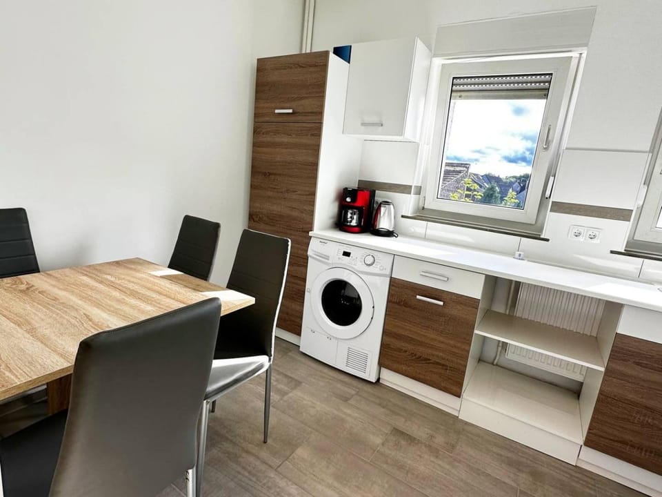 Kitchen or kitchenette, Seating area, Dining area, dishwasher, oven, stove, washing machine, dryer