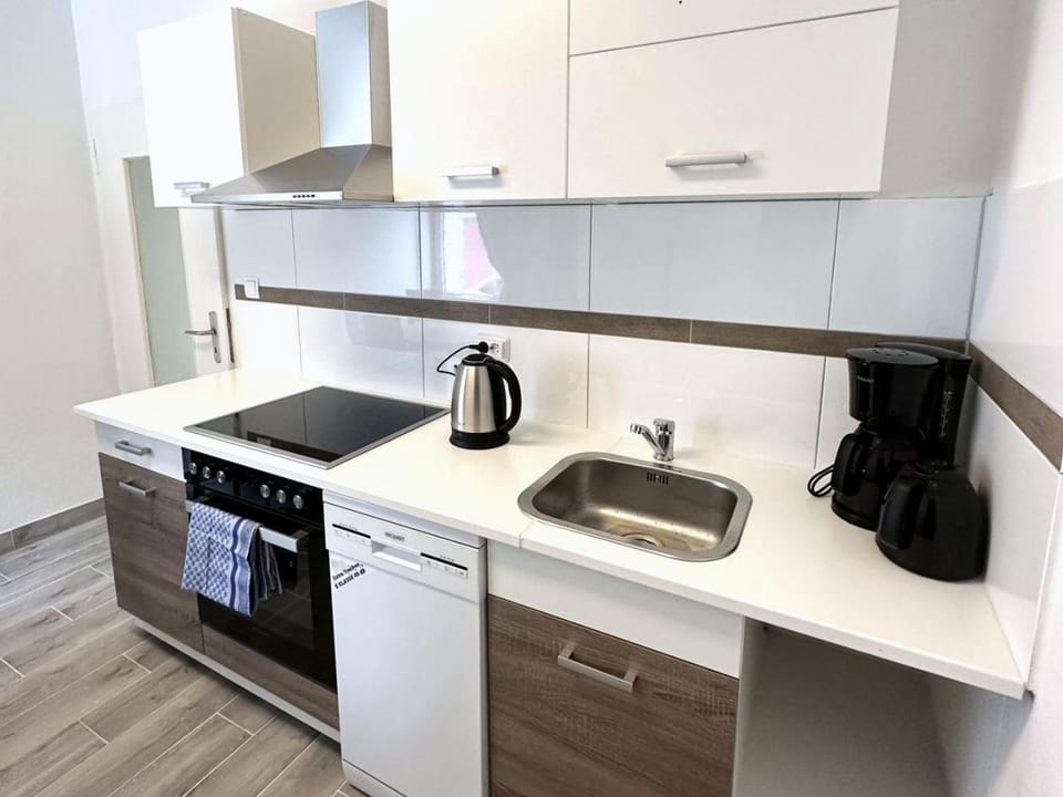 Kitchen or kitchenette, dishwasher, stove