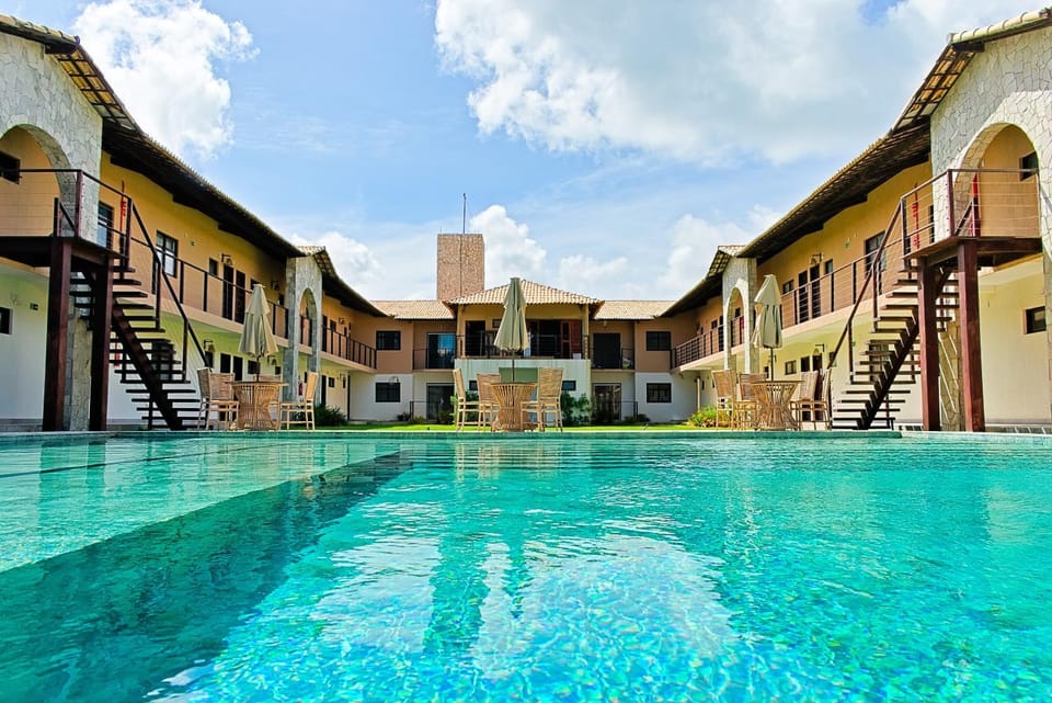 Property building, Day, Pool view, Swimming pool, sunbed