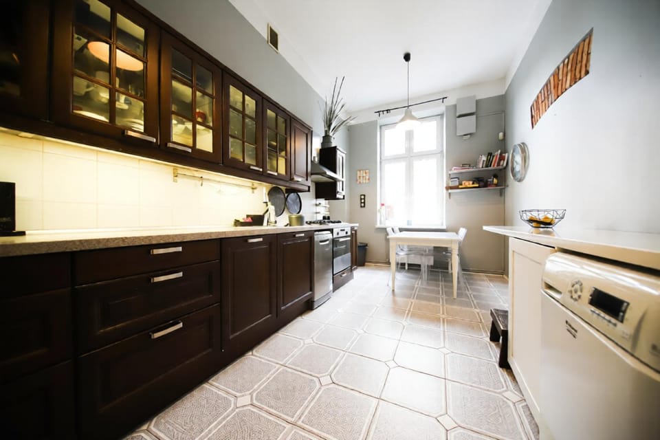 Kitchen or kitchenette, dishwasher, oven, stove