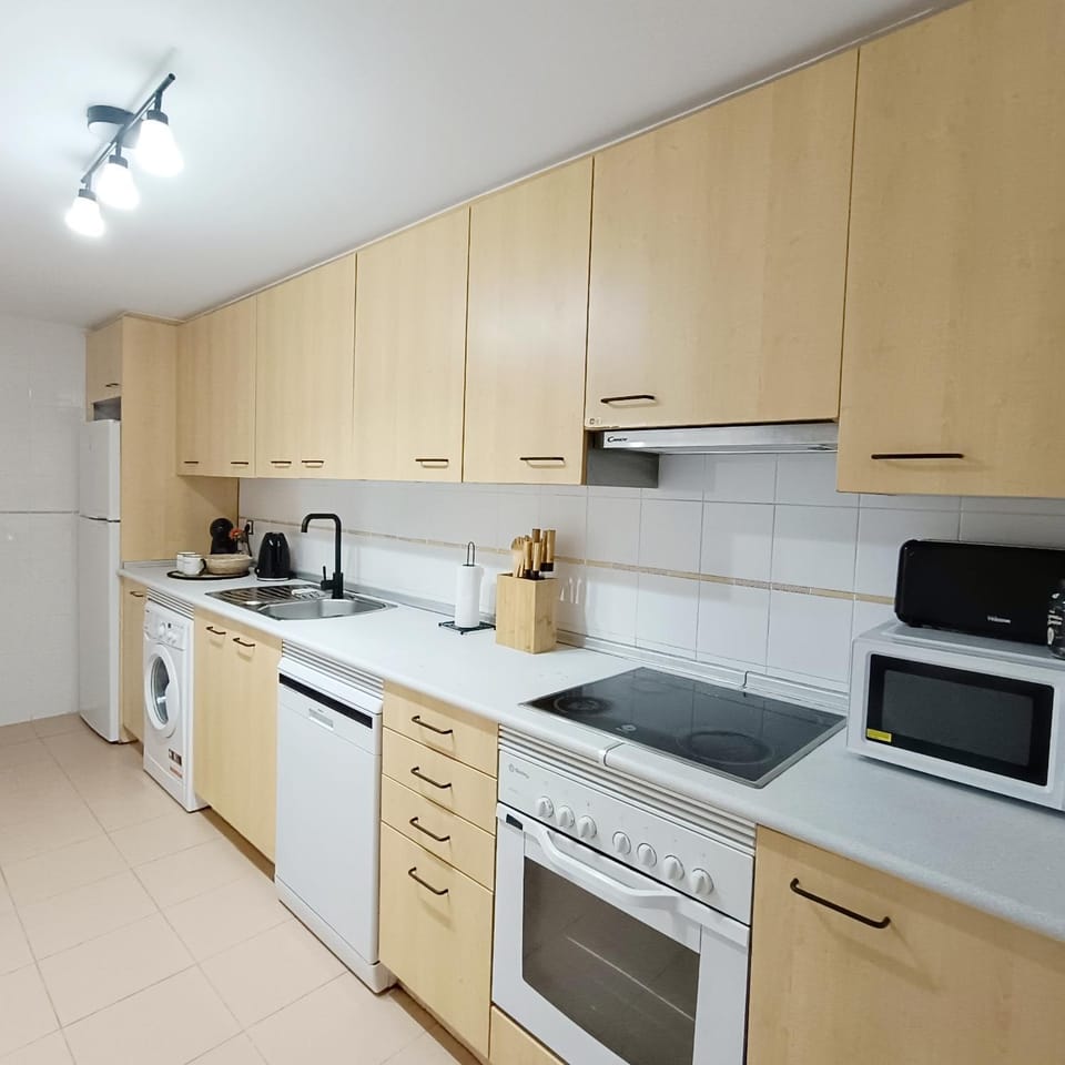 Kitchen or kitchenette, dishwasher, oven, stove, toaster